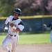 A Huron player rounds third base and heads to home plate in the game against Pioneer on Monday, May 13. Daniel Brenner I AnnArbor.com